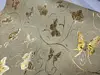 Autocolant bej glitter cu fluturi aurii, rolă de 90x200 cm