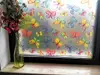 Folie geam autoadezivă, Folina, sablare cu fluturi colorați, rolă de 90x300 cm, racletă pentru aplicare inclusă