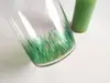 Cilindru din sticlă cu lumânare verde