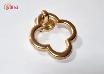 buton metalic tragator floare aurie