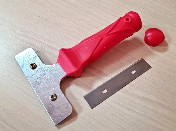 razuitor cu lama metalica pentru curatarea geamurilor