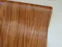 Autocolant mobilă Gold Nussbaum, d-c-fix, lemn nuc auriu, rola de 90 cm x 5 metri, cu racletă şi cutter